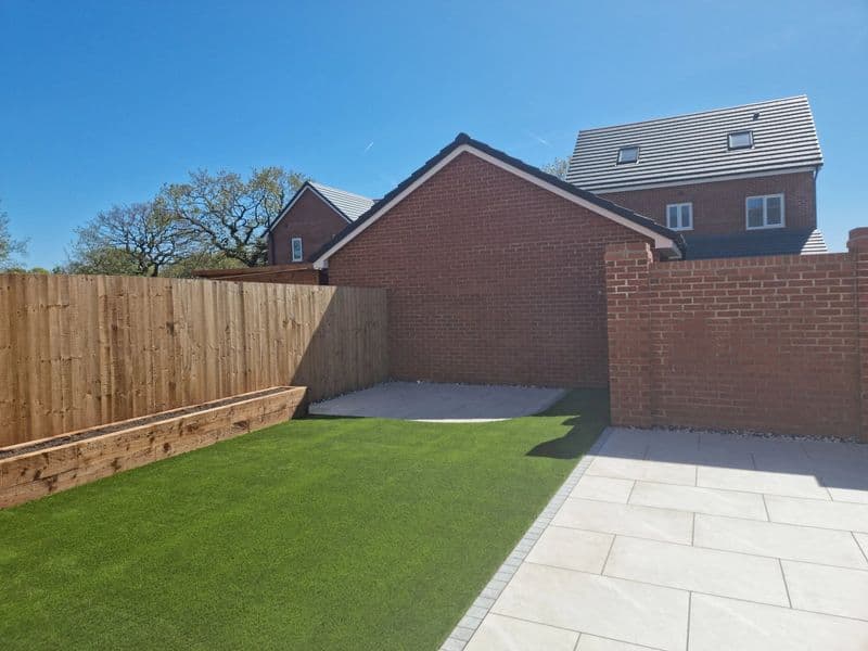 Porcelain patio, stepping stone path, sleeper planting bed  — finished landscaping in Chorley