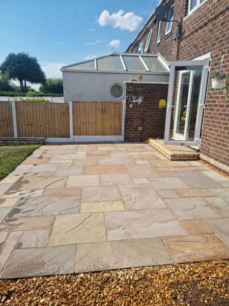 Indian Sandstone Patio & Tumbled brick beds in Blackburn — finished landscaping in Blackburn