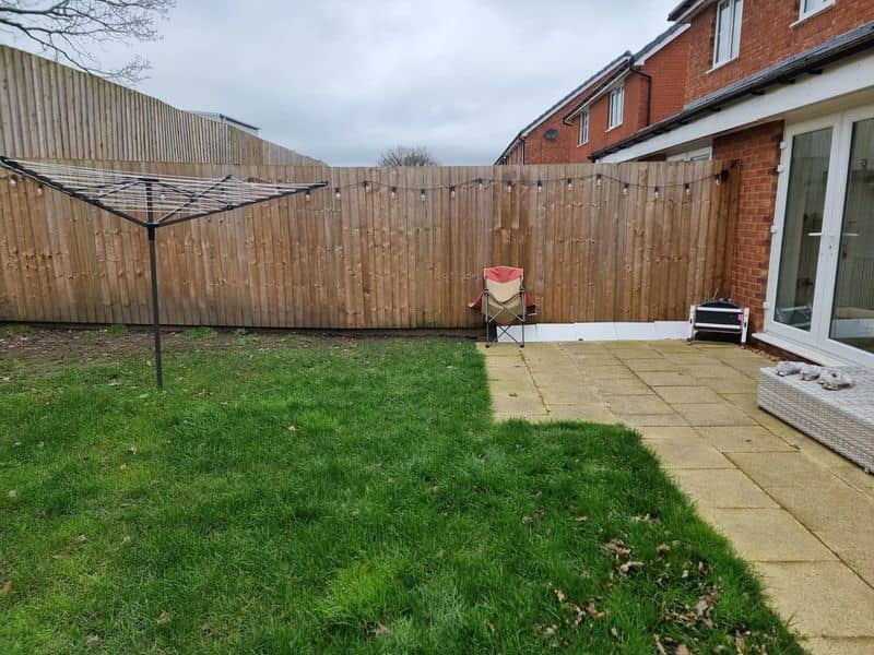Composite Decking, Sandstone Paving & French Drain in Bridge before works — Bridge