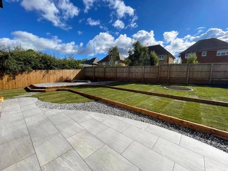Tiers in a sloped garden, Porcelain Paving & Composite Decking after landscaping — Preston