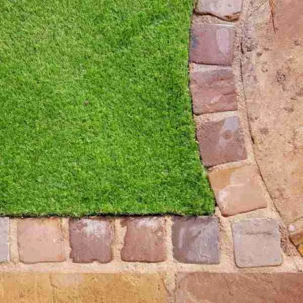 Artificial grass and block stone edging