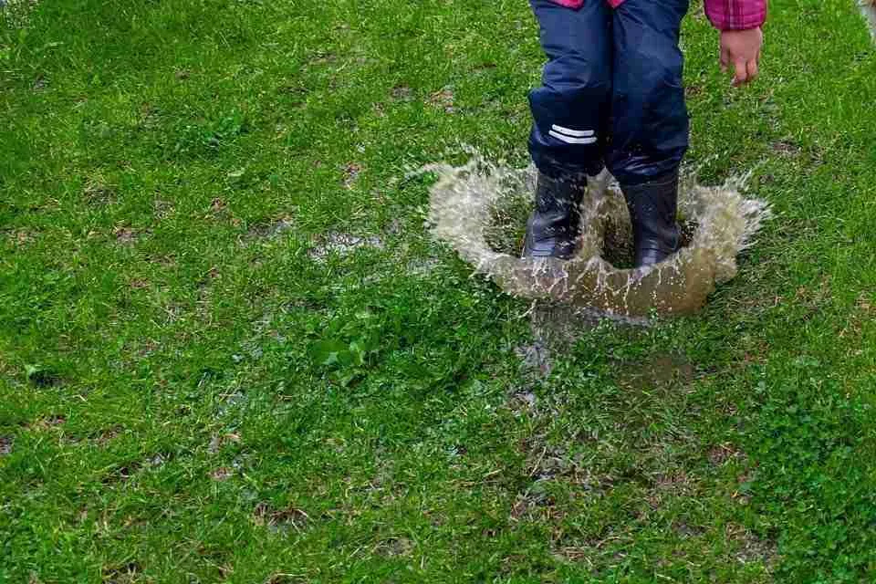 Waterlogged garden Persona splashing in a waterlogged garden