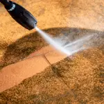 Pressure washed cleaning sandstone paving