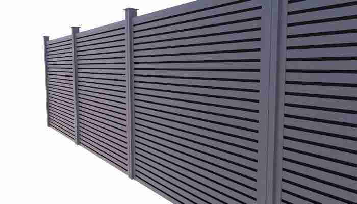 Grey composite fence built from a kit
