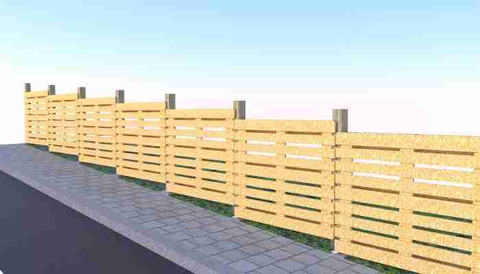 Pallet fencing running up a shallow hill