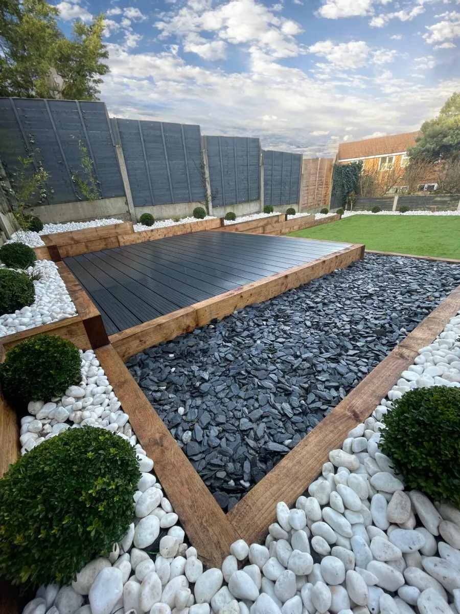Tiered garden with gravel terraces, composite decking and artificial grass. An Acorn Landscape Gardening project in Fullwood Preston
