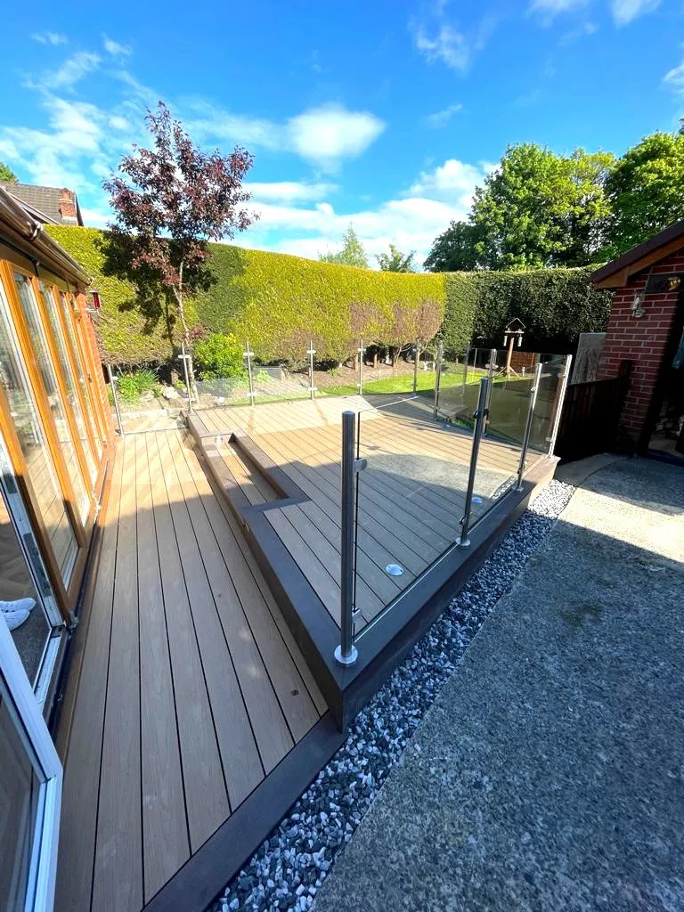 LArge capped composite decking area with lights and balustrade