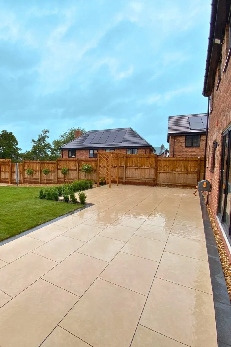 Expertly installed cream porcelain patio by Acorn Landscape Gardening, showcasing the elegant and high-quality work of leading paving contractors in Preston.
