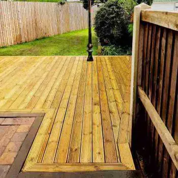 Wooden decking laid on soil/grass area