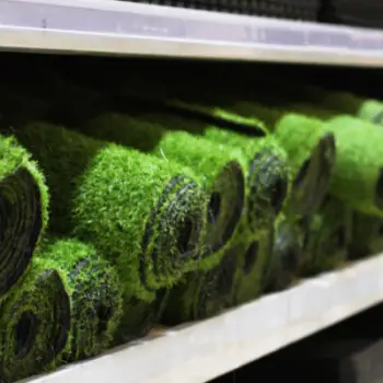 Rolls of artificial grass on shelves